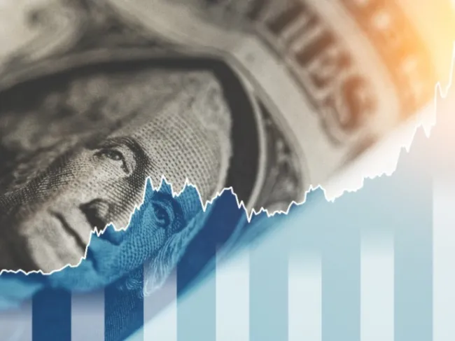 rising graph with dollar bill